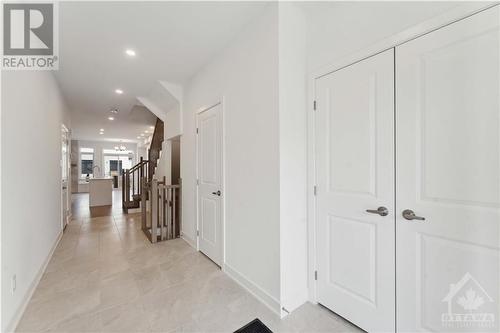 Foyer with large closet with swing doors