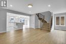 Open-Concept Main Living features hardwood stairs Open-Concept Main Living features hardwood stairs