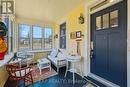 Inviting and functional enclosed front porch. Inviting and functional enclosed front porch.