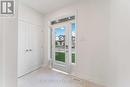 Bright foyer with ceramic tile flooring Bright foyer with ceramic tile flooring
