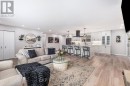Bright space with luxury vinyl and pot lights Bright space with luxury vinyl and pot lights