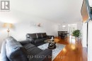 Lovomg room with warm hardwood flooring Lovomg room with warm hardwood flooring
