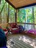 Covered porch for relaxing outside rain or shine.