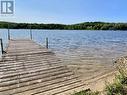 Property purchase includes a separate 21ft x 155ft waterfront lot across the road with a private dock.