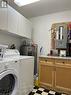Laundry room with extra storage and folding counter.