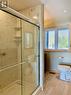 Ensuite has an over-sized shower with glass door.