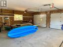Large 26ft x 24ft garage area is finished with insulated double overhead doors with openers. Great to store cars, boats & cottage toys!