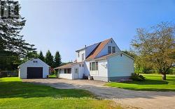 Driveway from Somers Street West to side door access. Beautiful corner lot.