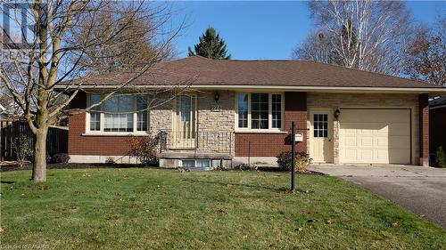 Ranch-style home with a garage and a front yard