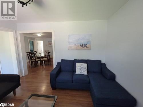 Living room with dark hardwood / wood-style floors