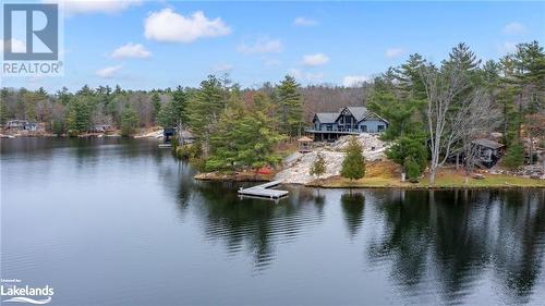 Property view of water with a dock