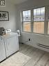 LAUNDRY SUNROOM WITH HEATED FLOORS