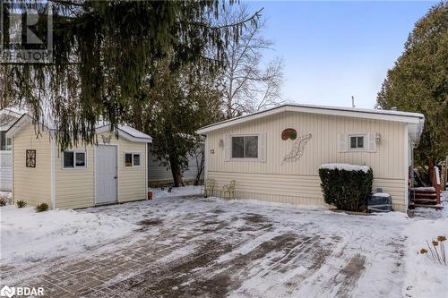 View of snow covered back of property