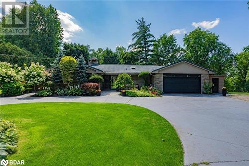 Ranch-style home with a garage and a front yard