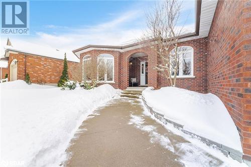 View of snow covered property entrance