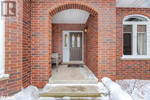 View of snow covered property entrance