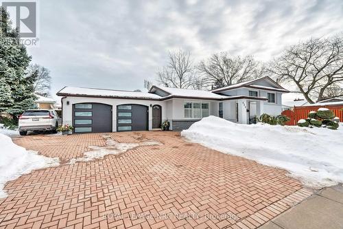 View of the house from the front & large driveway