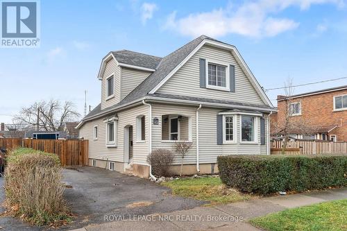 Vinyl sided home with covered porch.