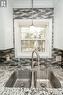 View of lake at kitchen sink
