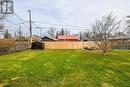 Fully Fences yard with storage shed