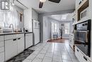 The spacious kitchen leads to an addition