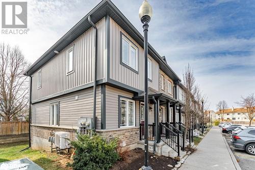 View of side of home featuring fence, cooling unit, and board and batten siding