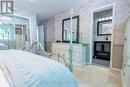 Primary bedroom has double closet and...