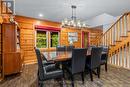Stunning dining area log wood walls