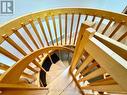 Custom spiral staircase to lower level walkout.