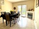 Dining Room with Fireplace and Walkout to Yard