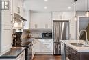 Stainless steel appliances include a dishwasher
