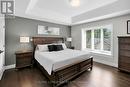 Primary Bedroom with hardwood floors