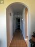 hallway leading to bedrooms & bathroom