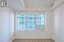 Bedroom with roller blinds and closet