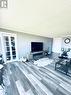 Living Room French Doors to Den & Guest Bedroom.