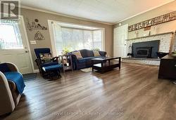 Bright Living Room with Wood-Burning Fireplace