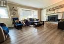 Bright Living Room with Wood-Burning Fireplace