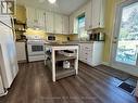 Functional Kitchen with Walkout to Deck