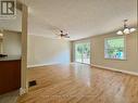Living room area with walk out to decking.