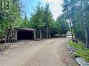 Separate carport near the entrance of the driveway