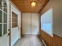 Enter the large mudroom with double door storage.