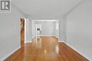 Open Living & Dining Areas with Hardwood Flooring