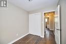3rd bedroom looking down hall to 4 pc bath