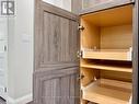 Pantry-style storage with roll-out shelving.