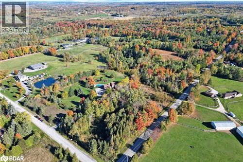 View of property location featuring a heavily wooded area and a large body of water