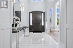 Impressive Foyer with a Remote-Lowering Chandelier