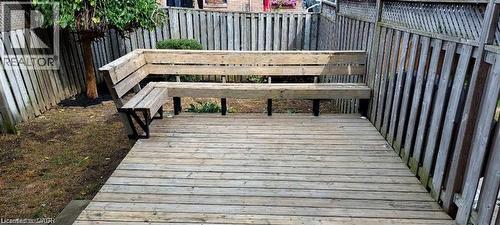 Wooden terrace featuring a fenced backyard