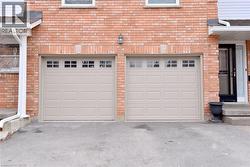 Garage with asphalt driveway