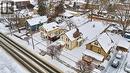 Snowy aerial view featuring a residential view