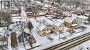 Snowy aerial view featuring a residential view